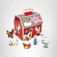 Play setup featuring the Take-Along Barn and its wooden figures