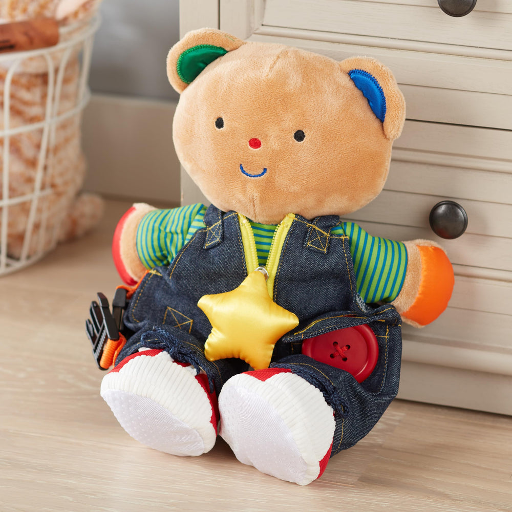 Melissa & Doug Teddy Wear bear removable shoes encourage fine motor practice.