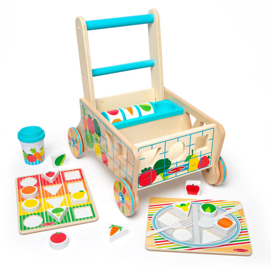 Melissa & Doug wooden grocery cart with shape-sorting pieces for pretend play and motor skills.