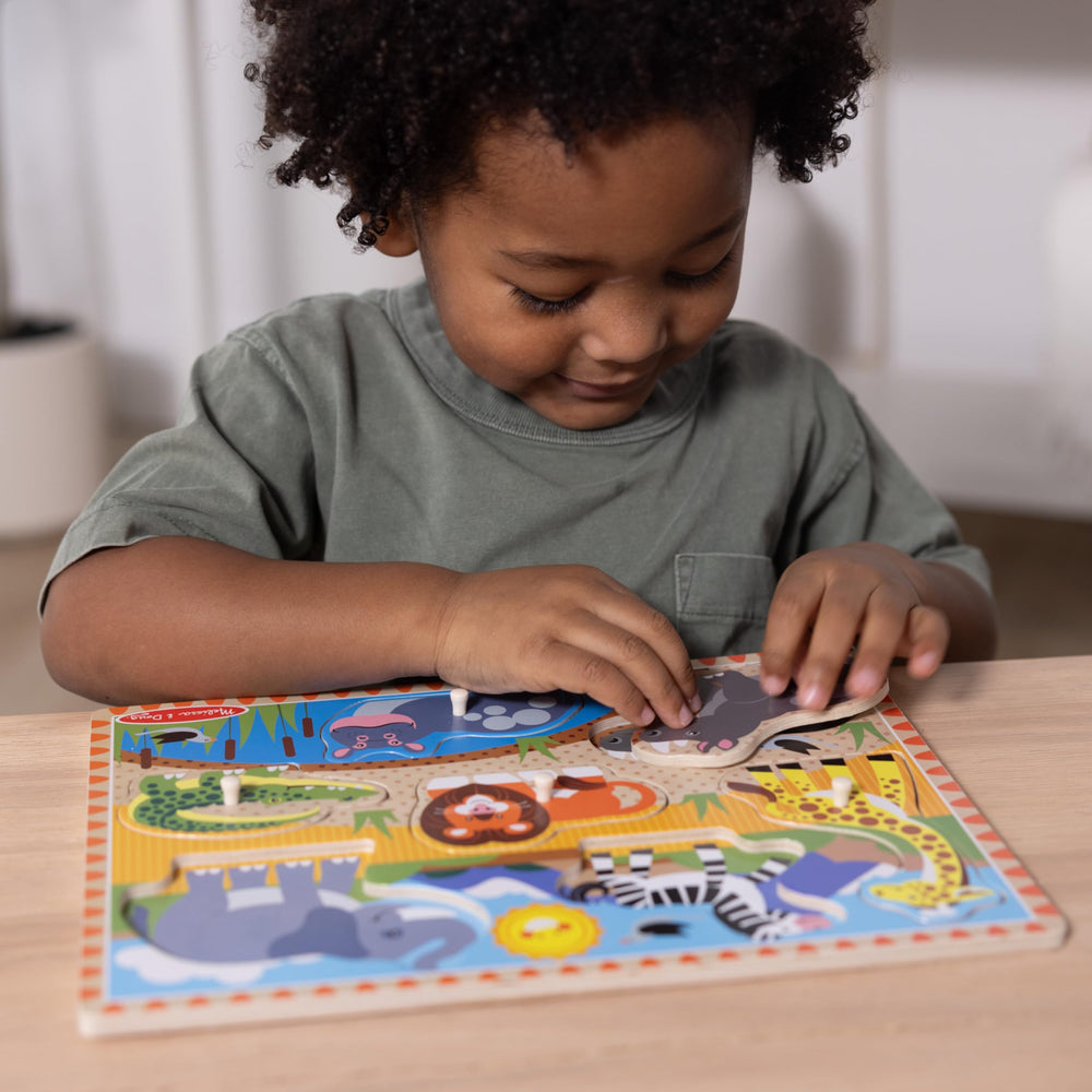 Melissa & Doug wooden peg puzzle set shown in a sturdy box