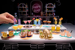 MGA's Miniverse Make It Mini Happy Hour bar cabinet ball display holding finished mini cocktails.