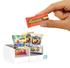 Mini credit card inserted and MGA's Miniverse vending dispensing a mini for hands-on play