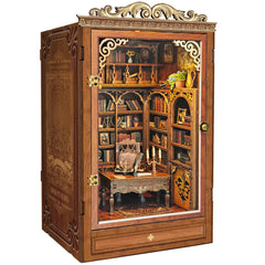 Miggley Time Book House with lit windows adds warm shelf ambiance.