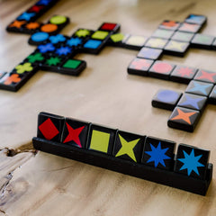 MindWare Qwirkle Collector's Edition introduces new tiles for variety.