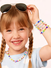 MINIMISSMIANYC shell, flower, evil eye charms add playful accessories.