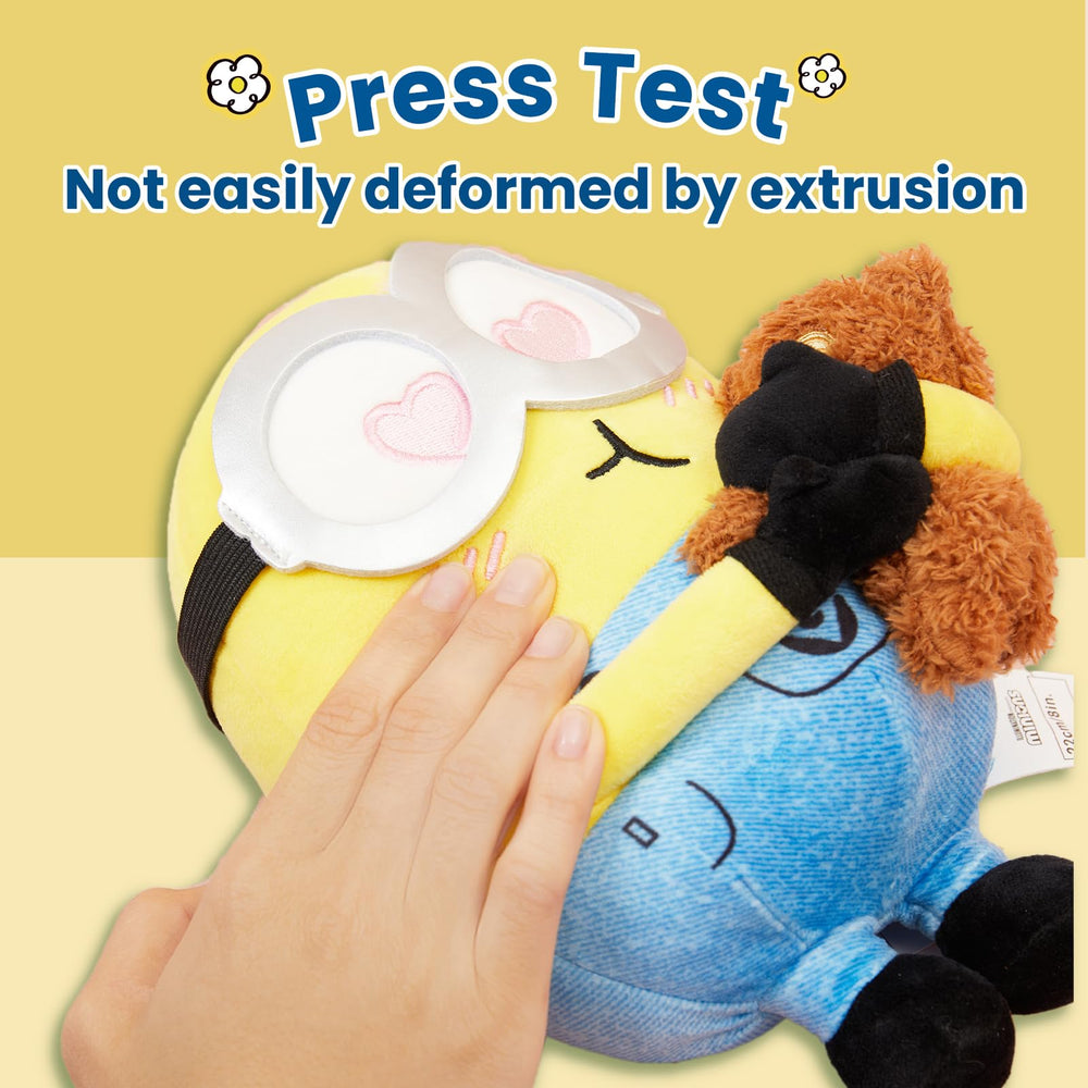 MINISO Minions Bob hugging Tim close-up highlighting soft cuddle appeal.