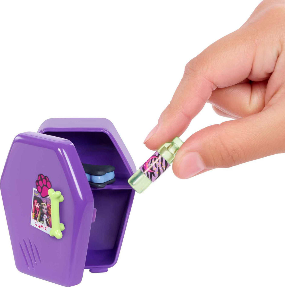 Monster High Clawdeen mini-fridge opens for pretend snacks.