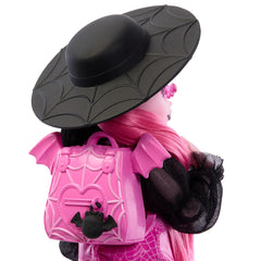 Monster High Draculaura doll pink top with sheer sleeves showcases vibrant fashion play.
