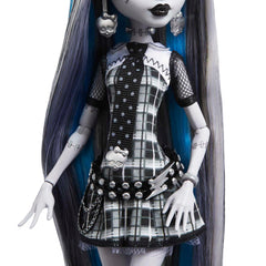 Monster High Frankie Stein in plaid mini dress showcases bold monochrome drama.