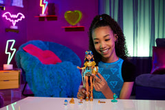 Monster High Hissette cobra pet beside the Cleo De Nile doll