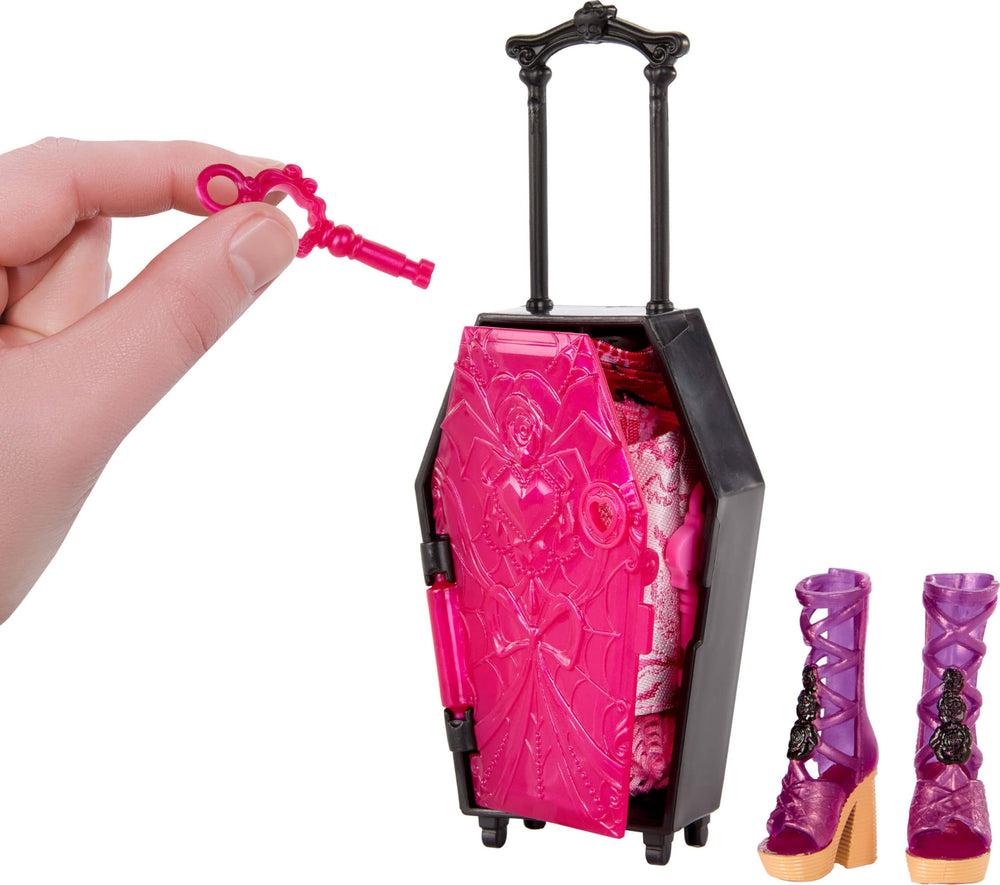 Doll-sized suitcase opens to reveal additional fashion surprises.