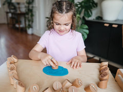 Montessori & Me Alphabet Stamps show bold letter impressions for early word building.
