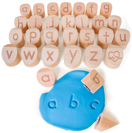 Montessori & Me Alphabet Stamps reveal lowercase letters for hands-on clay play and early recognition.
