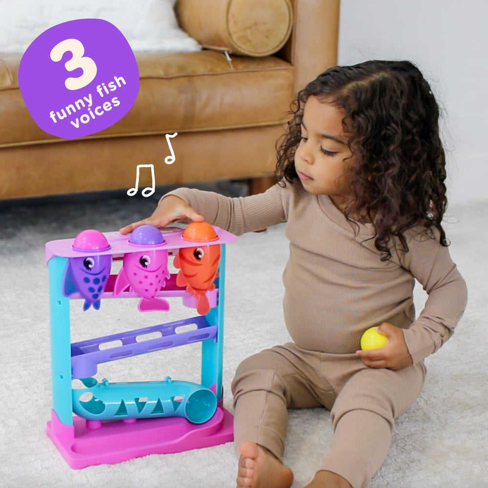 Move2Play Feed The Fish ball drop slot image encourages fine motor skills during play.