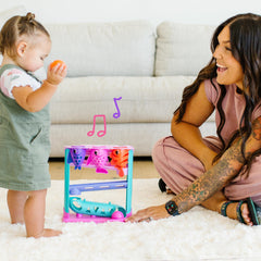 Move2Play Feed The Fish battery-compartment image notes batteries not included, ready for setup.