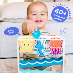 Move2Play Wooden Ocean Friends ball-drop arc features interactive play to boost fine motor skills.