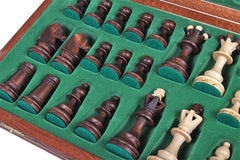 Folded Muba board with brass clasps secures pieces for travel and storage