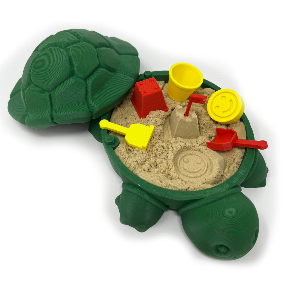 MunnyGrubbers mini desktop turtle sand box on a desk for stress relief.