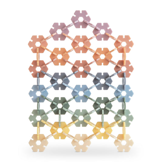 Mushie HEX Connect discs promote creative construction and spatial exploration.
