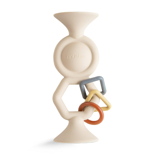 Mushie HexaPop suction toy top view for secure surface attachment during play