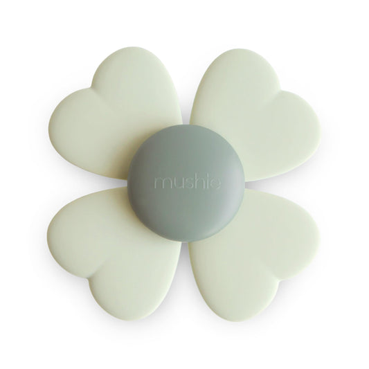 Mushie Lucky Suction Spinner Toy in bath promotes sensory engagement.