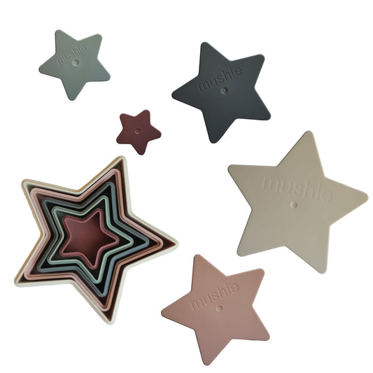 Mushie Nesting Stars Toy star stack set supports fine motor skills in toddlers.