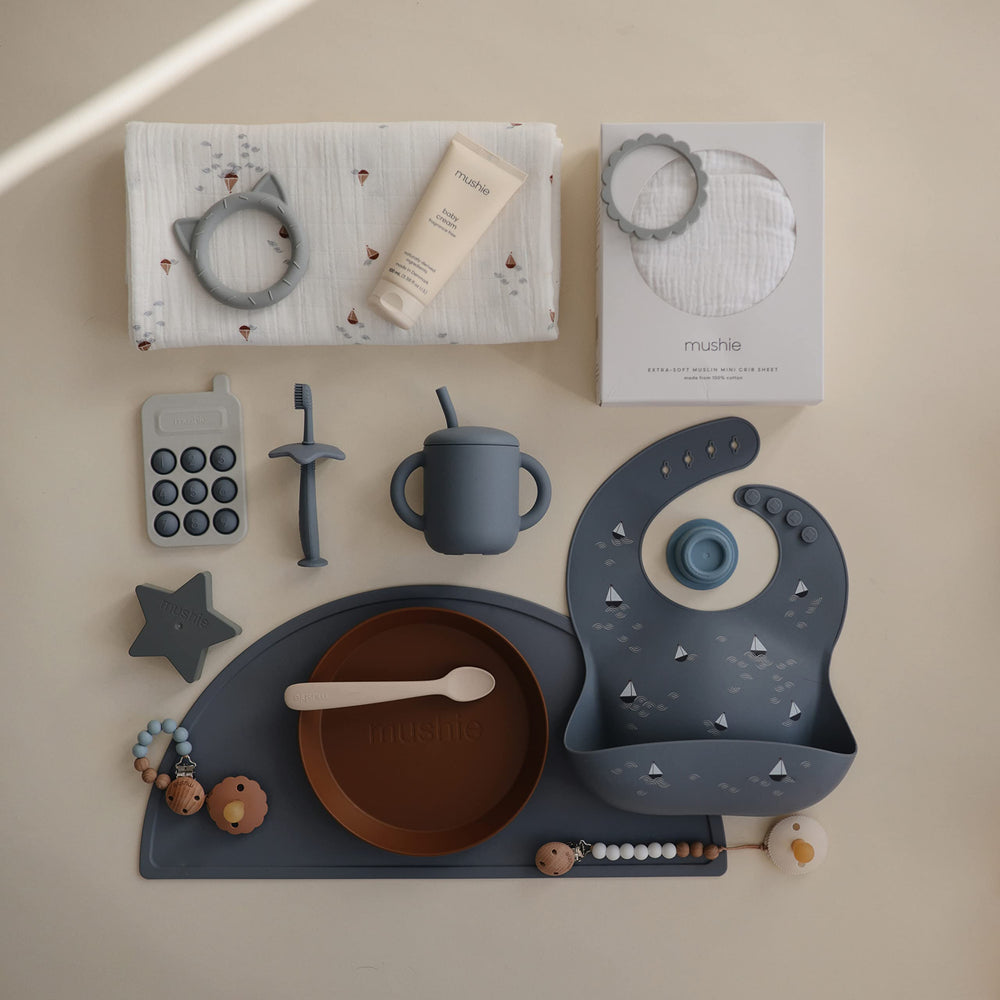 Mushie Phone Press Toy Tradewinds in a child-friendly setup for focus.
