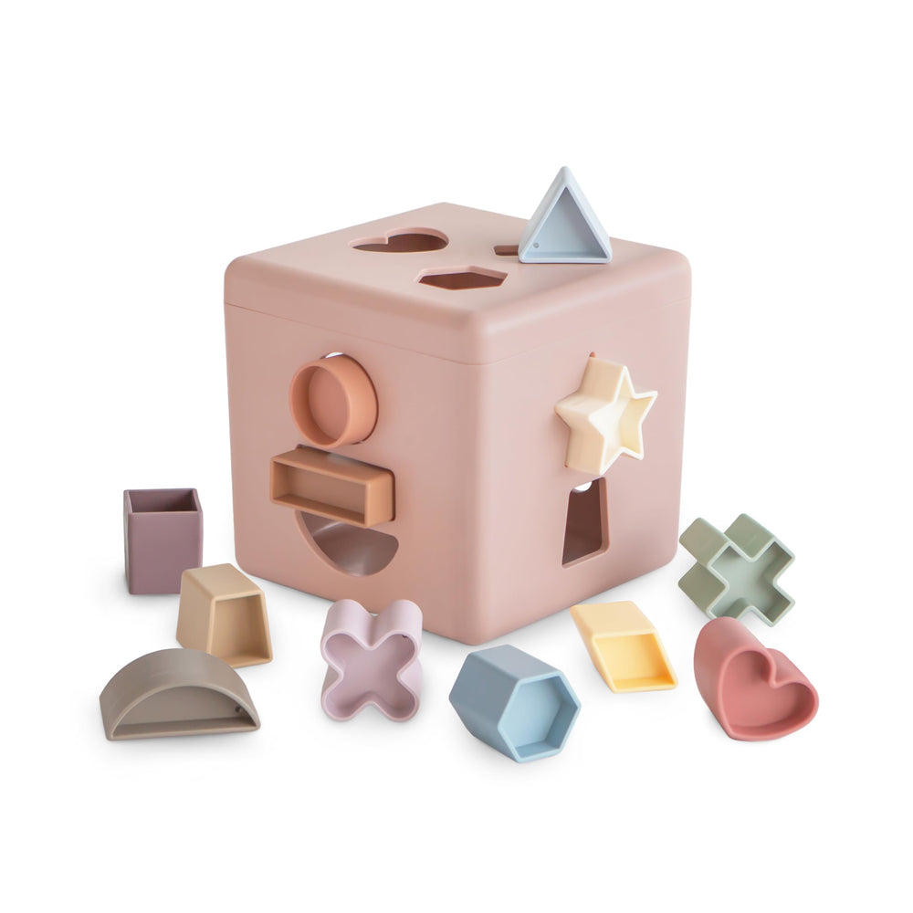 Mushie Shape Sorting Box Petal front view promotes shape recognition during play