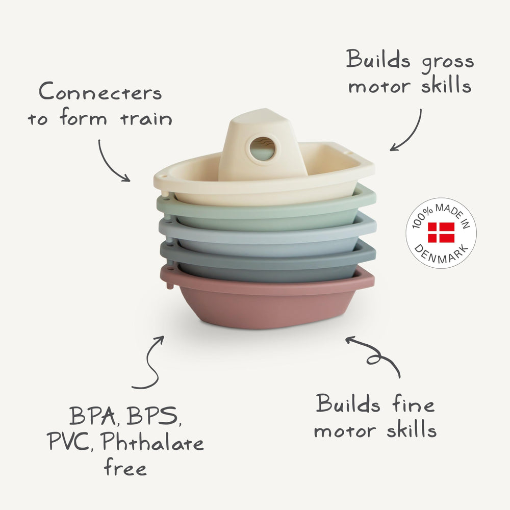 Mushie Stackable Bath Boats Petal 02 linked to form a floating train, promoting sequencing.