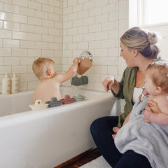 Mushie Stackable Bath Boats Train Assembly 01 demonstrates linked play for independent bath exploration.