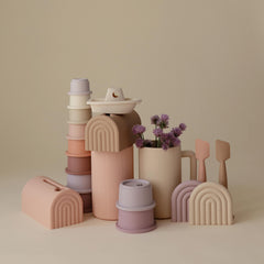 Mushie 8pc Petal cups neatly arranged for storage.