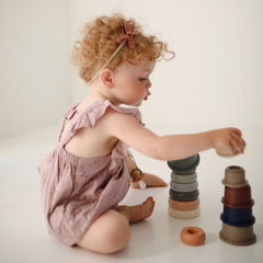 Mushie Stacking Cups Toy encourages baby-first stacking and hand-eye coordination through playful sorting.
