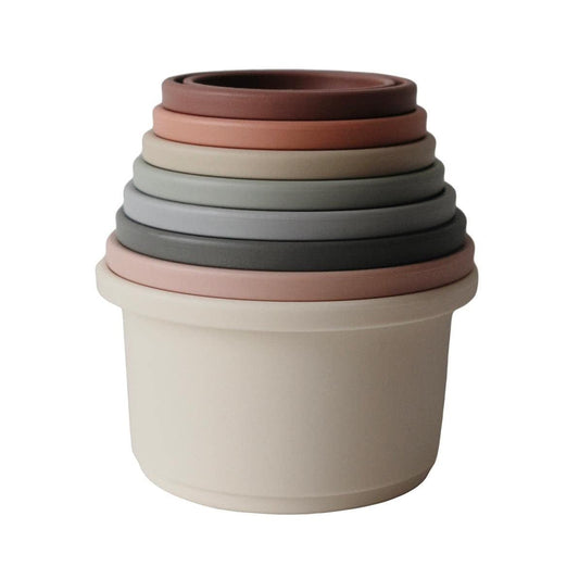 Mushie Stacking Cups Toy with bright colors stimulates visual tracking and engaging play sessions.