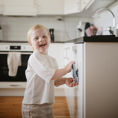 Mushie suction spinner on highchair demonstrates secure grip during independent play