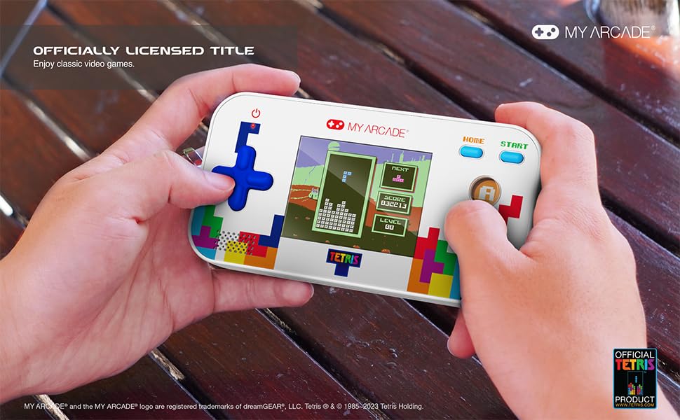 My Arcade held in hand to show size and pocket-friendly portability benefit