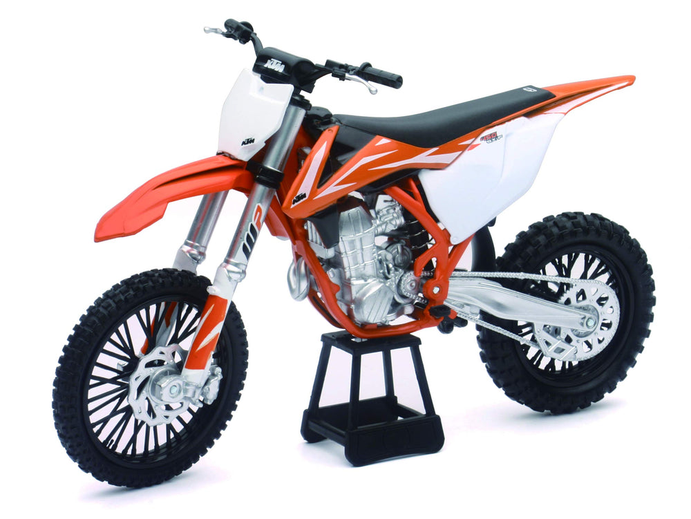 NewRay KTM 450 SXF dirt bike detail highlights precise trim and authentic KTM colors.