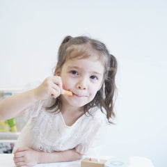 Nunukids hair salon accessories including scissors and dryer in wood finish.