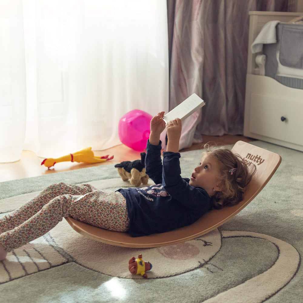 Nutty Toys wobble board wooden edges highlight child-safe design.