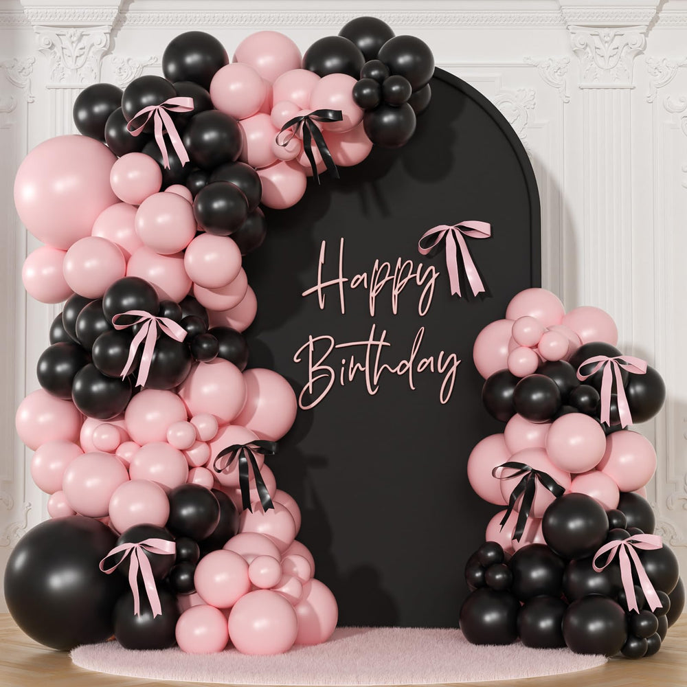 NuttyBash pink and black balloon arch kit setup creates a chic coquette backdrop.