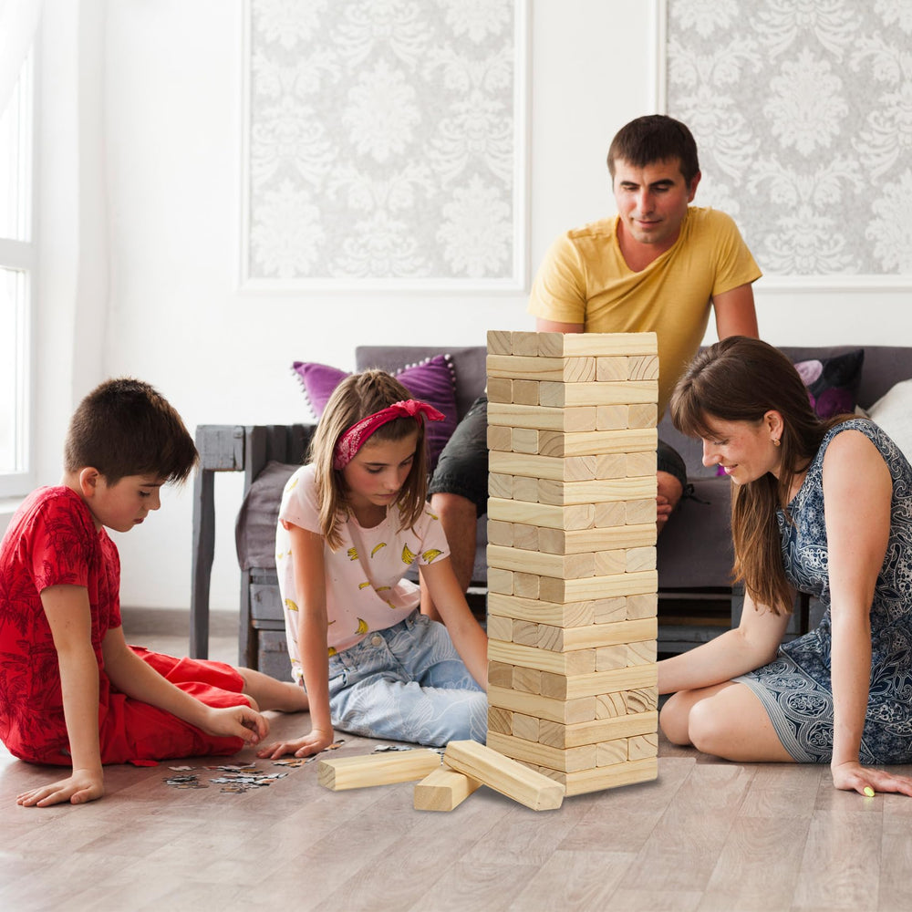 Olsa Giant Tumble Tower in use at an outdoor patio gathering.