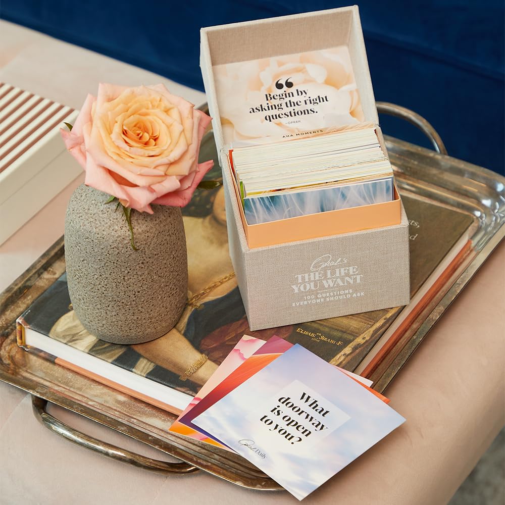 Oprah Daily mini notebook invites recording answers and aha moments.