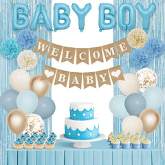 Ouddy Party welcome baby banner adds a welcoming focal point to the setup.