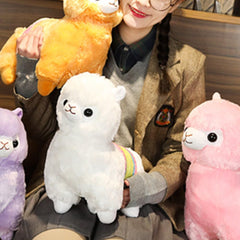 OUKEYI Alpaca plush toy side view highlights portable size for travel cuddles.