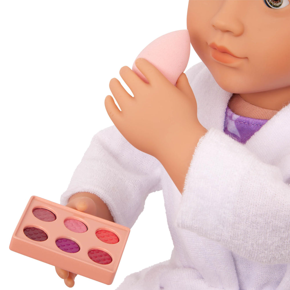 Our Generation makeup brushes set supports versatile styling during play.
