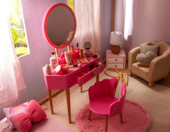 Our Generation pink vanity chair provides comfy seating during playtime.