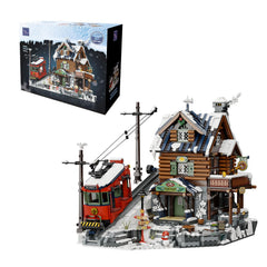 Pantasy Winter Summit lodge exterior shows a cozy alpine display for holidays.