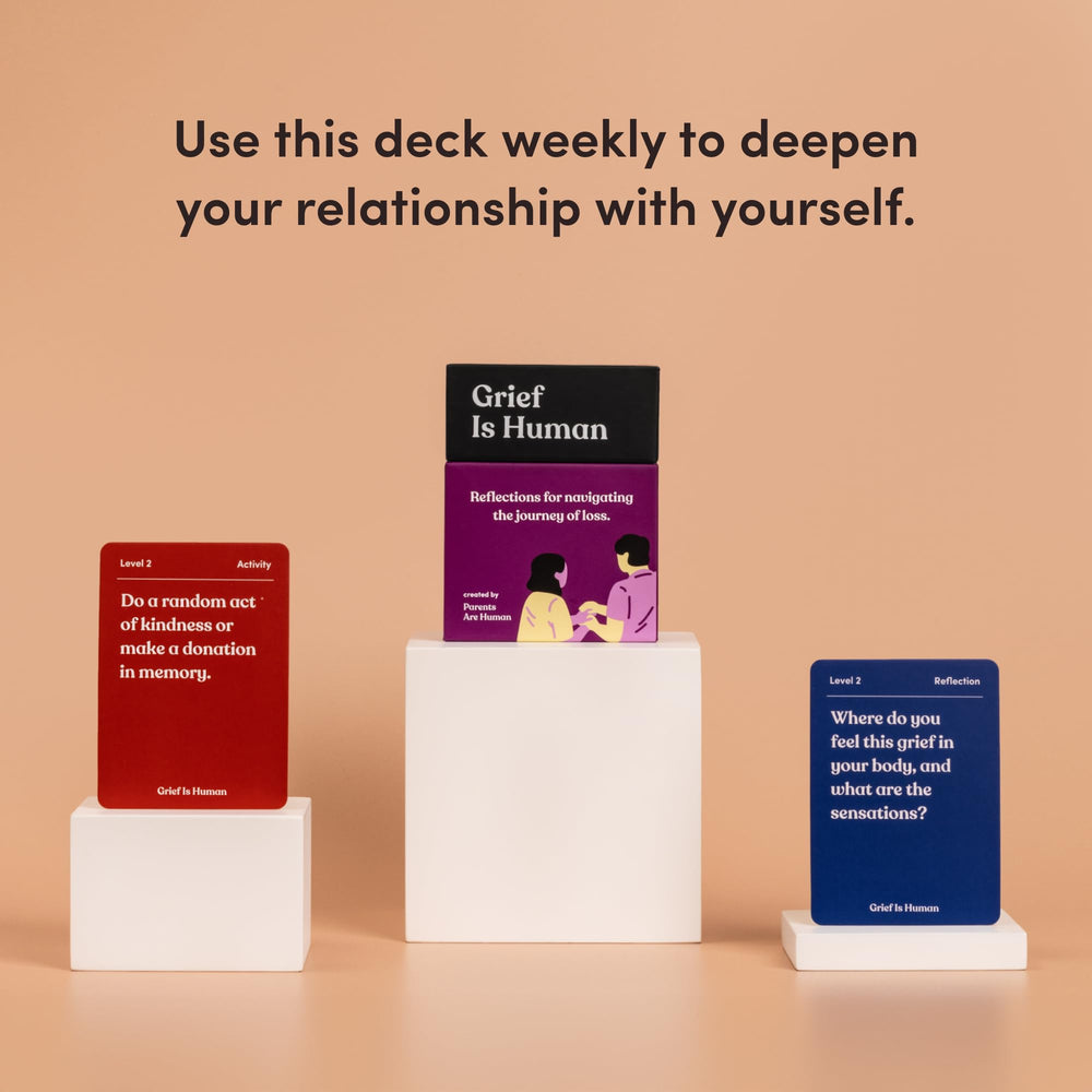 Close-up of Grief is Human card spread inviting honest sharing and listening
