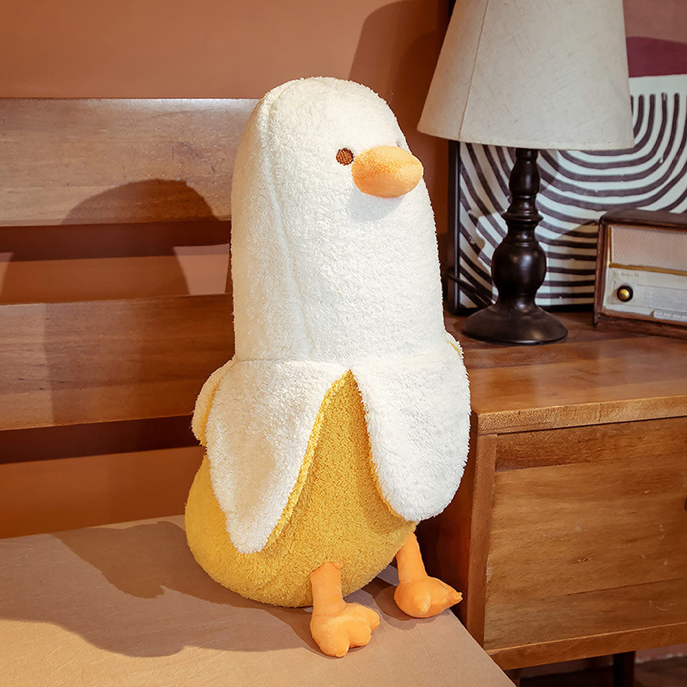 PEACH CAT banana duck plush hug demonstrating versatile cuddle companion.