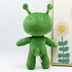 PHYDZFC green alien plush on a shelf display, adds playful decor to kids' rooms.