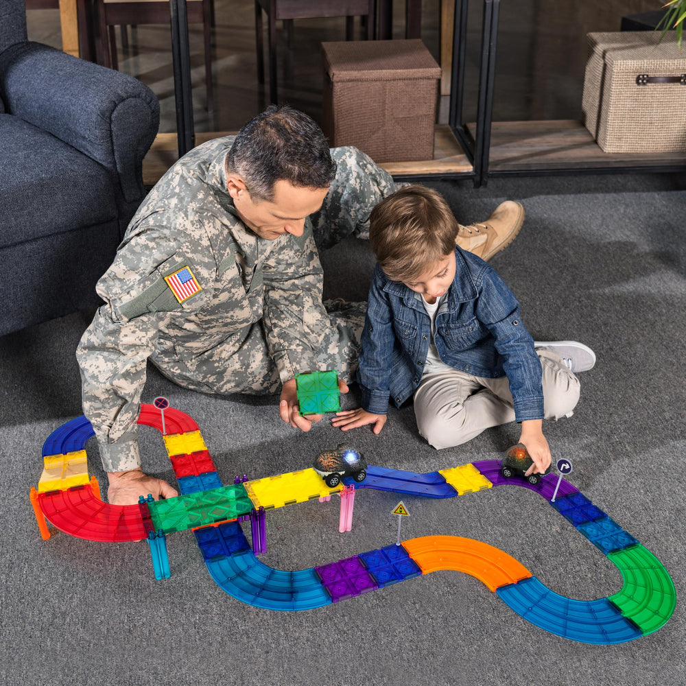 PicassoTiles dinosaur race cars—colorful vehicles spark storytelling and creative engineering play.